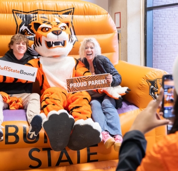 Student and Family with Benji in Big Chair 